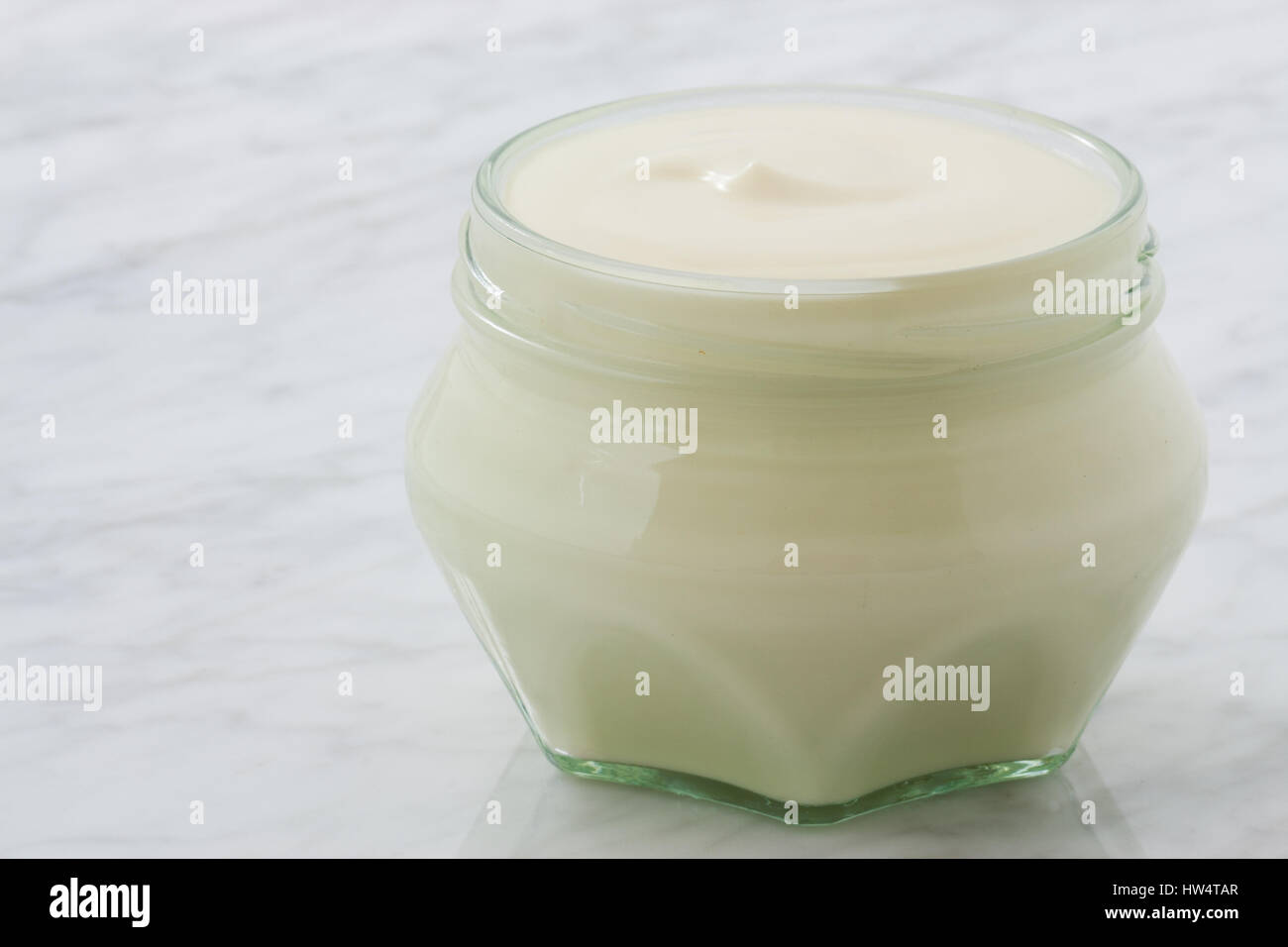 styled greek yogurt on carrara marble countertop Stock Photo