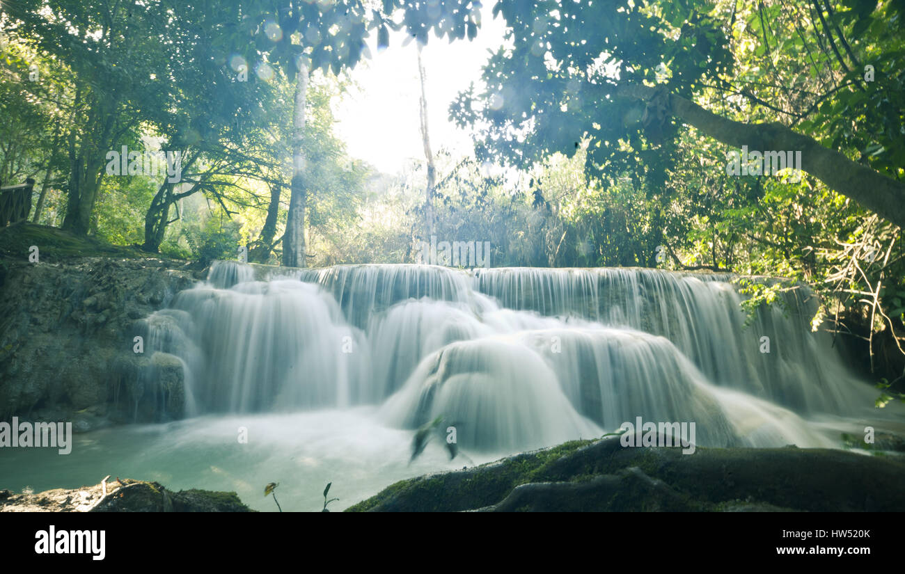 The spectacular Kuang Si Falls also known as Tat Kuang Si Waterfalls is a popular tourist destination in Luang Prabang, Laos. Stock Photo