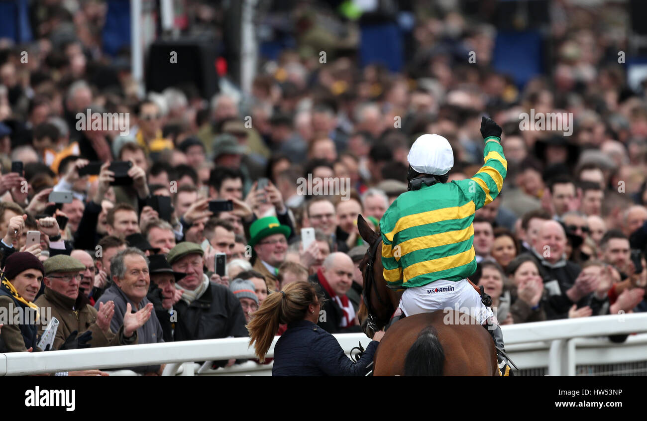 Jockey Richard Johnson celebrates after his winning ride on Defi Du Seuil in the JCB Triumph Hurdle during Gold Cup Day of the 2017 Cheltenham Festival at Cheltenham Racecourse. Stock Photo