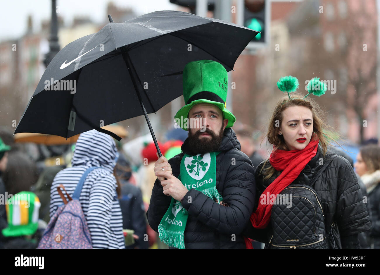 The crowd watch the St Patrick's Day parade on the streets of Dublin. Stock Photo