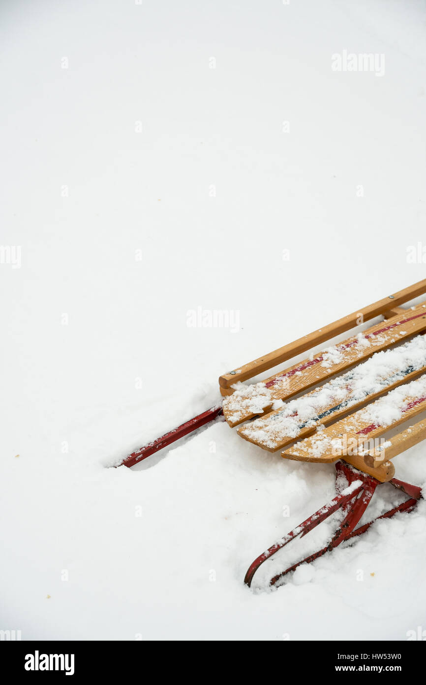 A vintage wooden sled in the snow Stock Photo