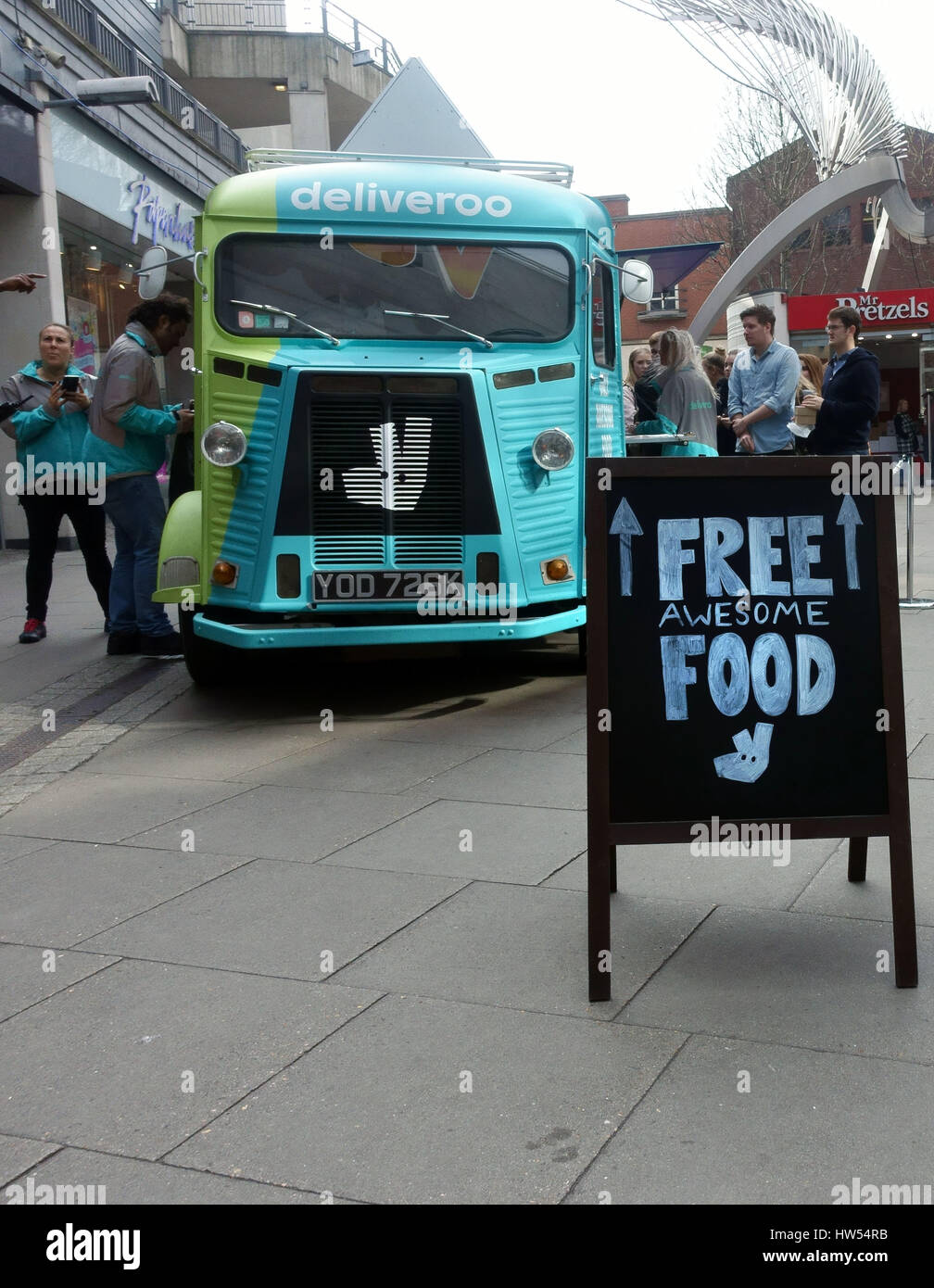 People queue for free food in Deliveroo promotion in North London shopping centre Stock Photo