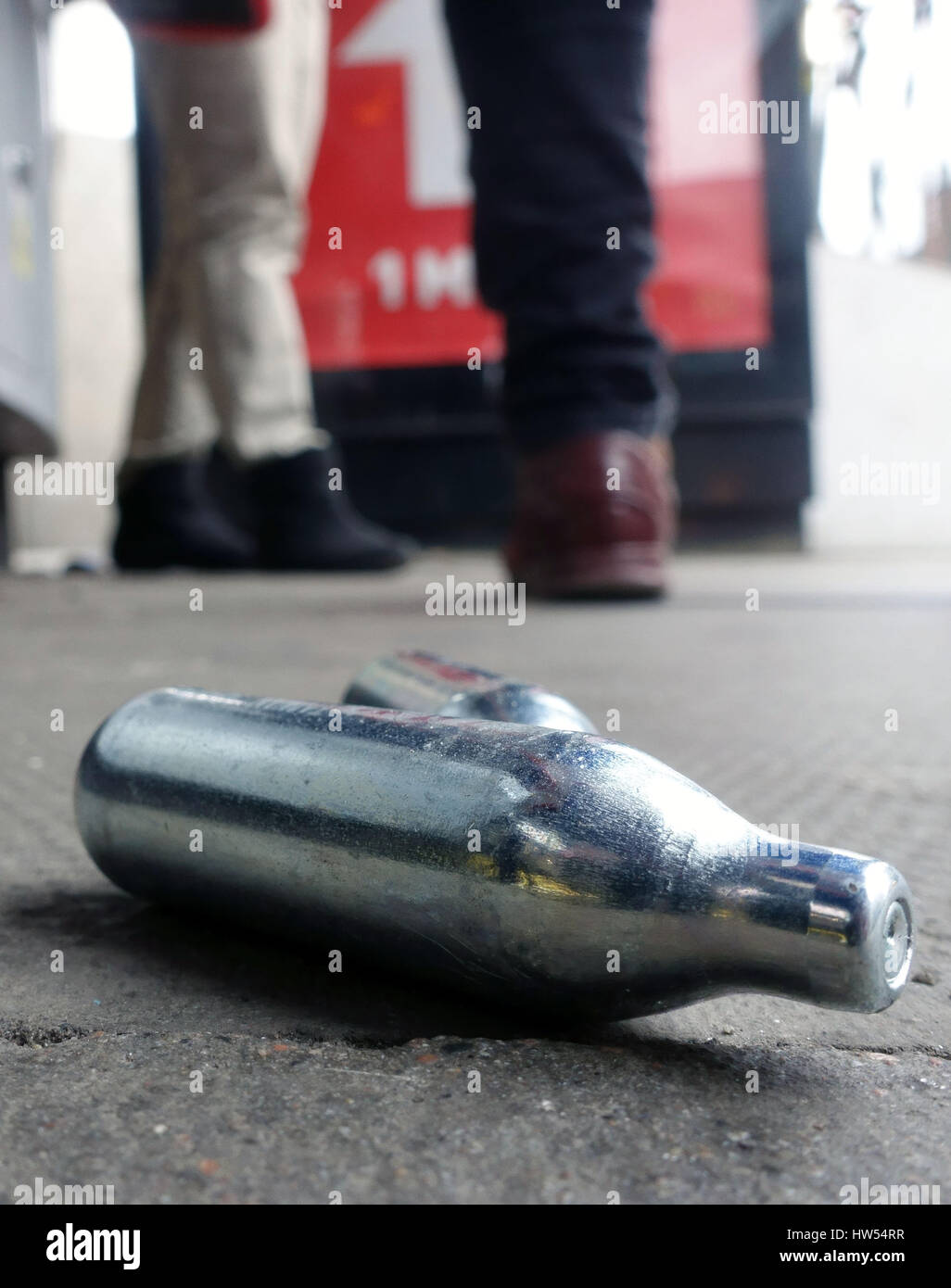 Discarded canisters of nitrous oxide (laughing gas) on London pavement