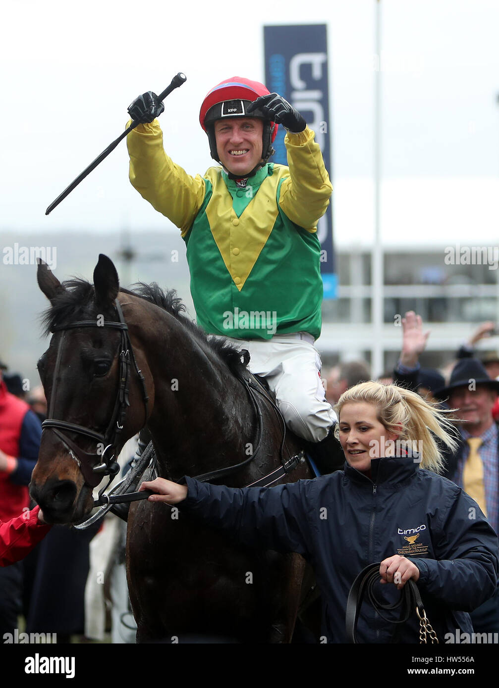 Jockey Robbie Power celebrates after his winning ride on Sizing John in the Timico Cheltenham Gold Cup Chase during Gold Cup Day of the 2017 Cheltenham Festival at Cheltenham Racecourse. Stock Photo