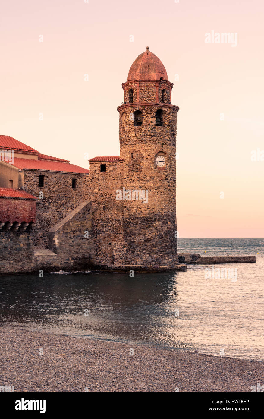 Collioure sunset over the Church of Notre Dame des Anges clocktower, Collioure, Côte Vermeille, France Stock Photo