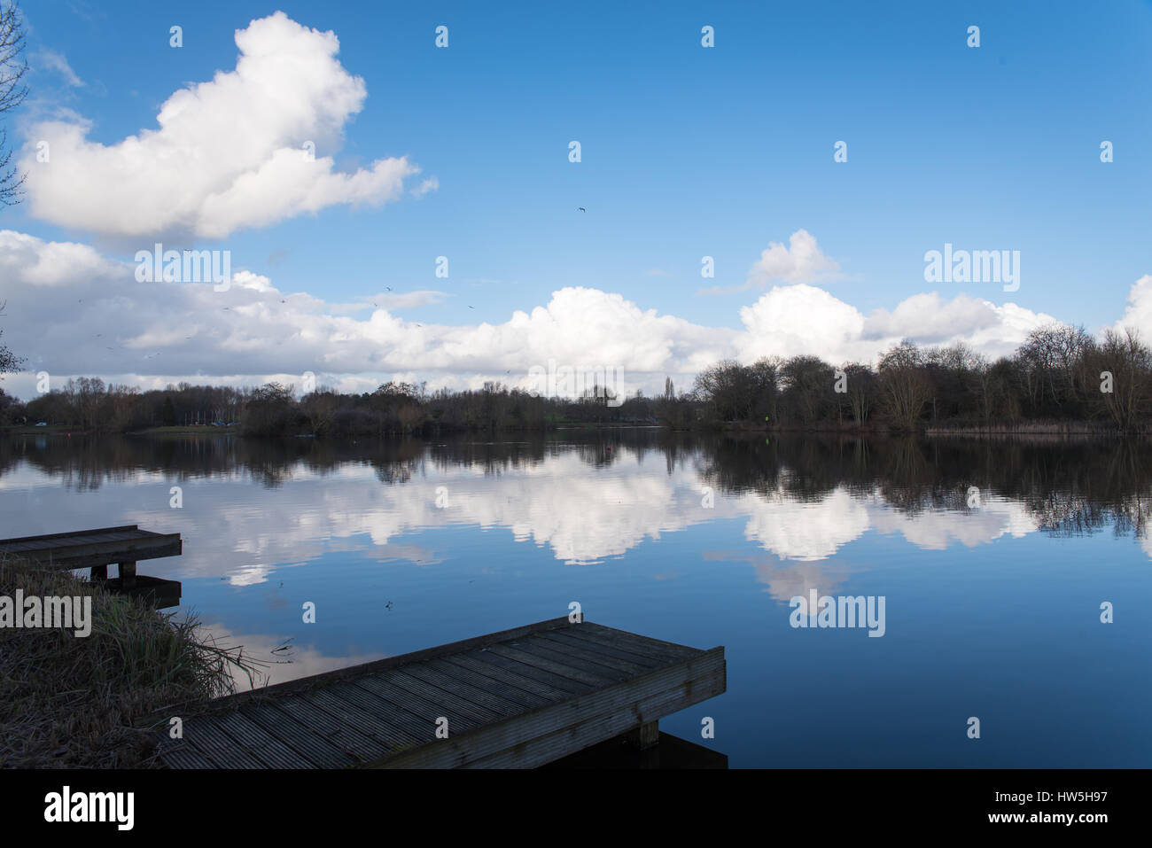 Water reflections on a sunny day at Arrow Valley Lake in Redditch Stock Photo