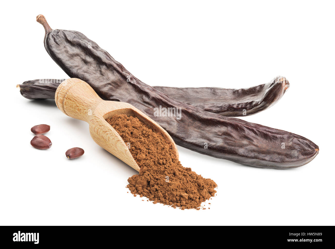 Carob powder and pods isolated on white Stock Photo