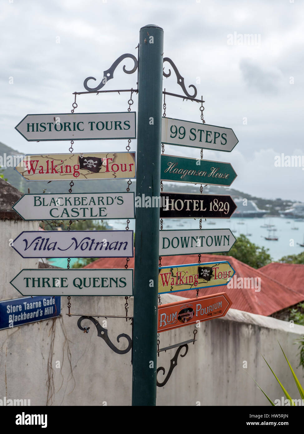 Signpost With Direction Signs To Popular Tourist Attractions In Charlotte Amalie, St Thomas U.S. Virgin Islands Stock Photo