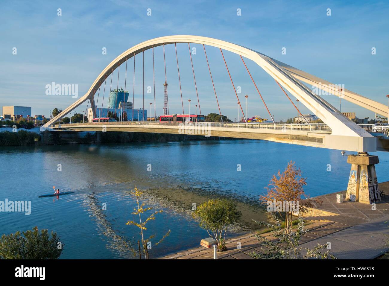 Spain, Andalusia, Seville, Guadalquivir basin and Barqueta Bridge built by Juan Jose Arenas and Marcos J. Pantaleon for the 1992 exhibition in the background, Isla de la Cartuja. Stock Photo