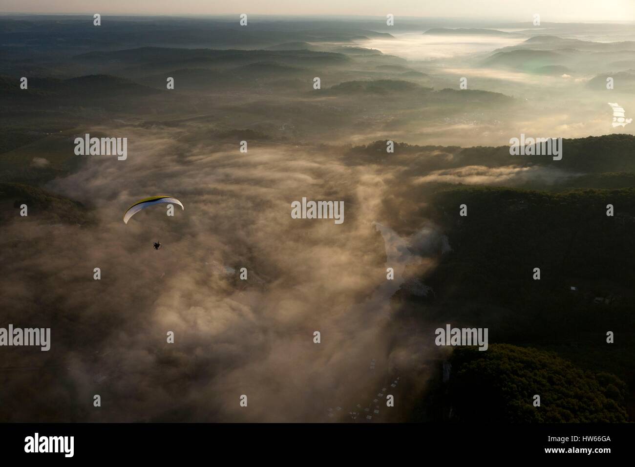 France, Dordogne, Black Perigord, Dordogne Valley, Vitrac, flying paramotor paraglider motor or in the mist (aerial view) Stock Photo