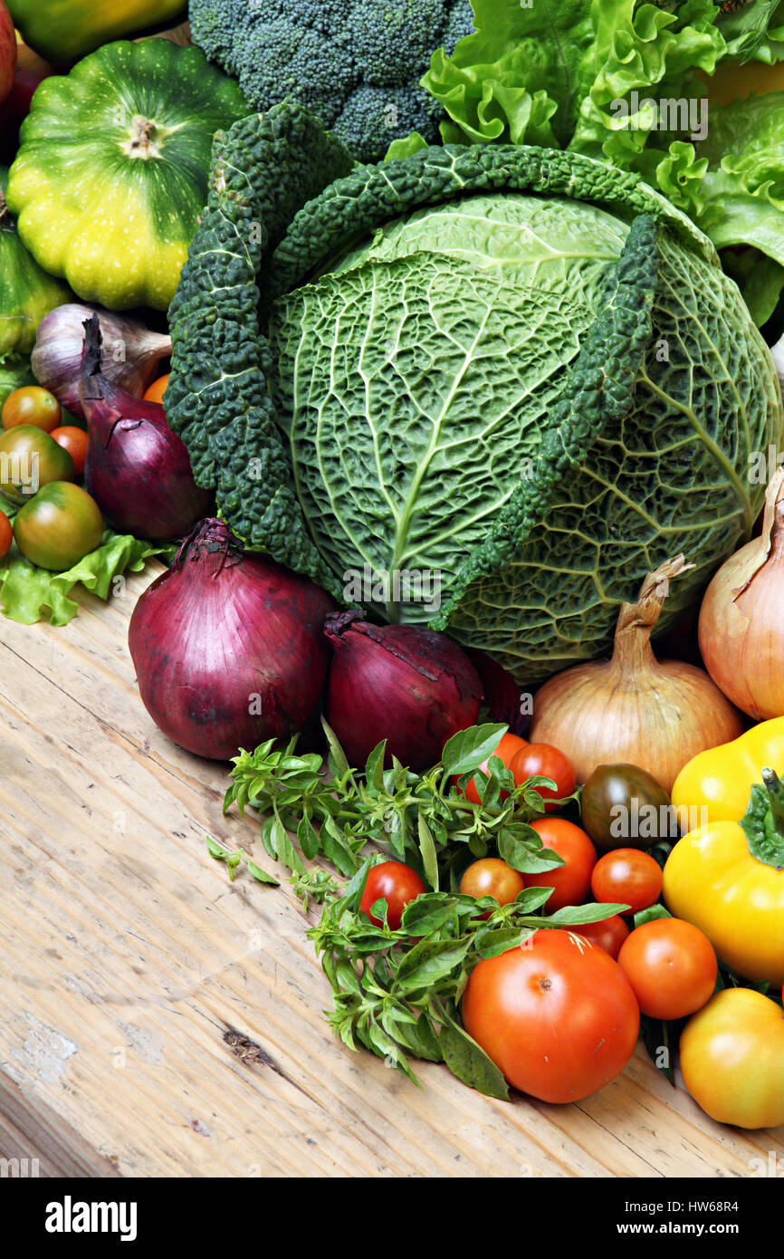 Fresh farm vegetable- onions,savoy cabbage, tomato- on the table. Stock Photo