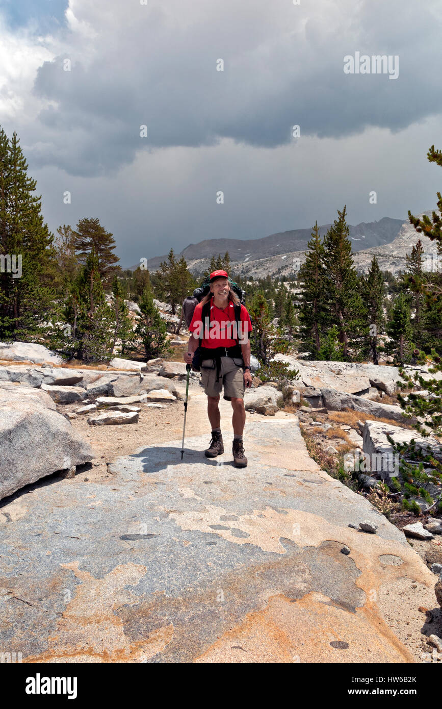 CA03081-00...CALIFORNIA - Hiker on the Piute Pass Trail in the John Muir Wilderness area of the Inyo National Forest. Stock Photo