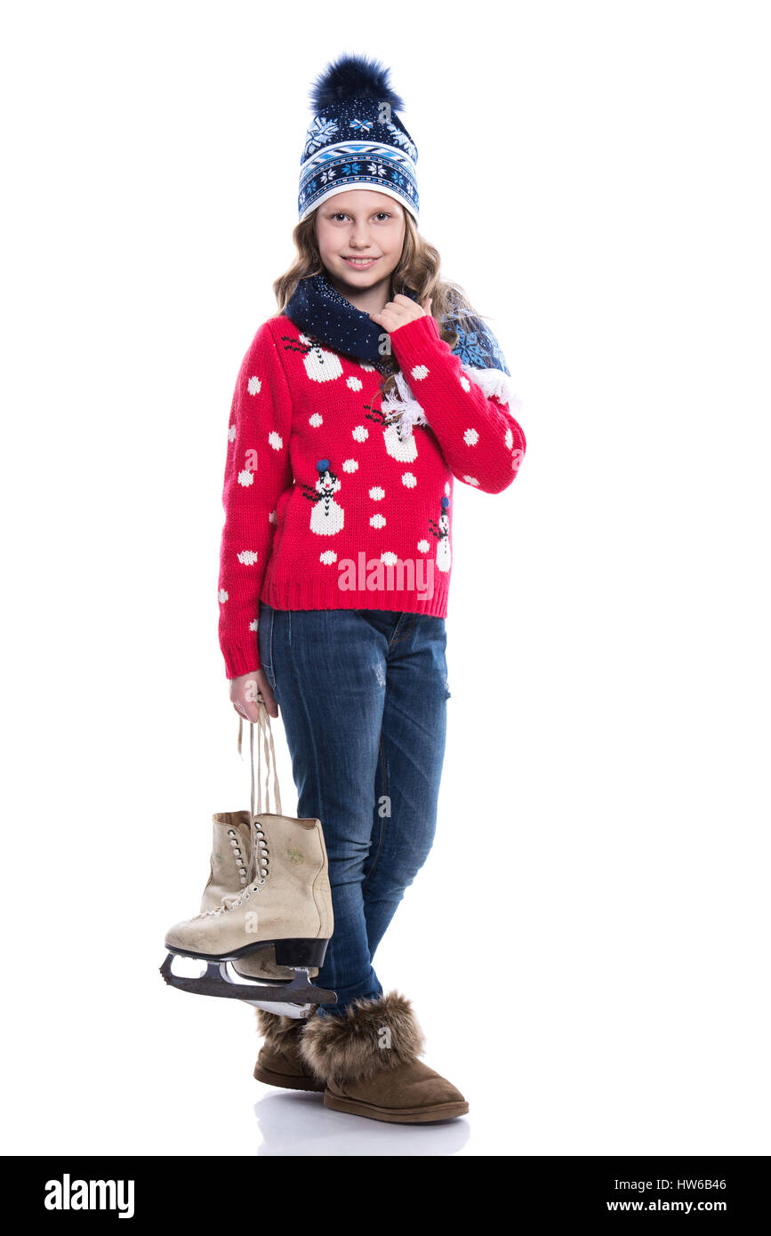 Pretty smiling little girl with curly hairstyle wearing knitted sweater ...