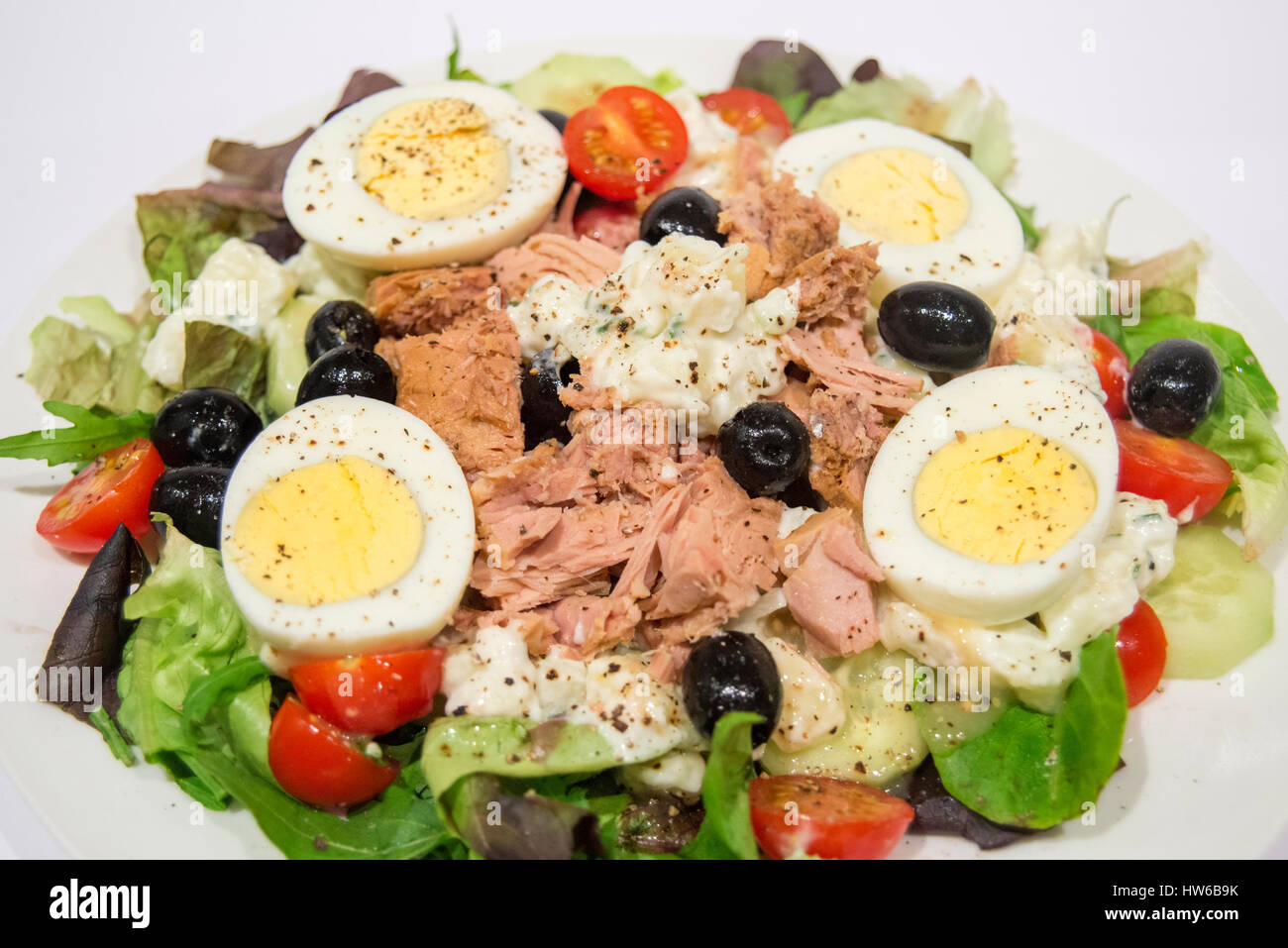 Salad nicoise with tuna olives egg potato tomato and fresh lettuce Stock Photo