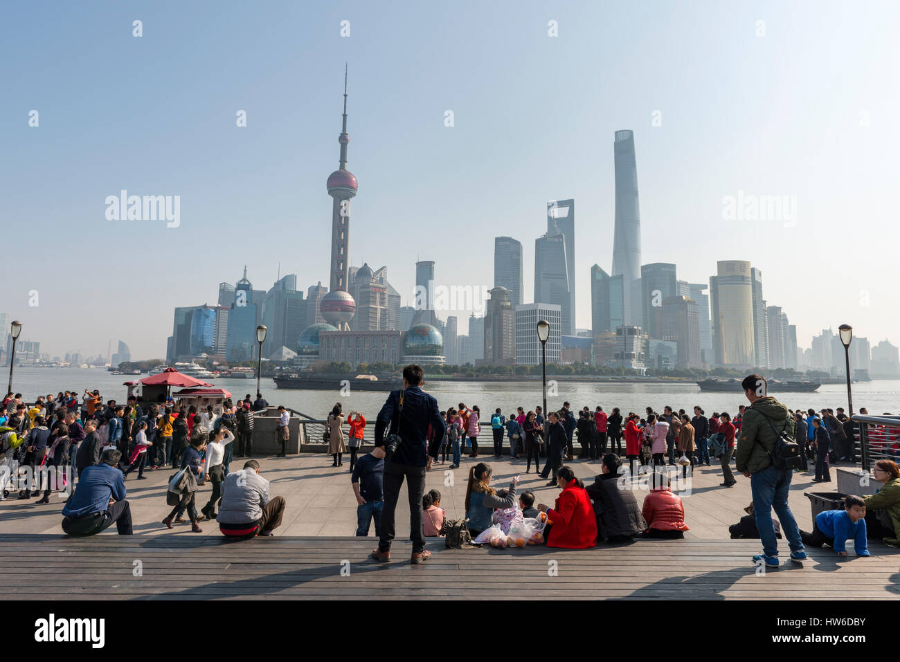 Seaside promenade The Bund, behind Oriental Pearl Tower and Shanghai Tower, Shanghai, China Stock Photo