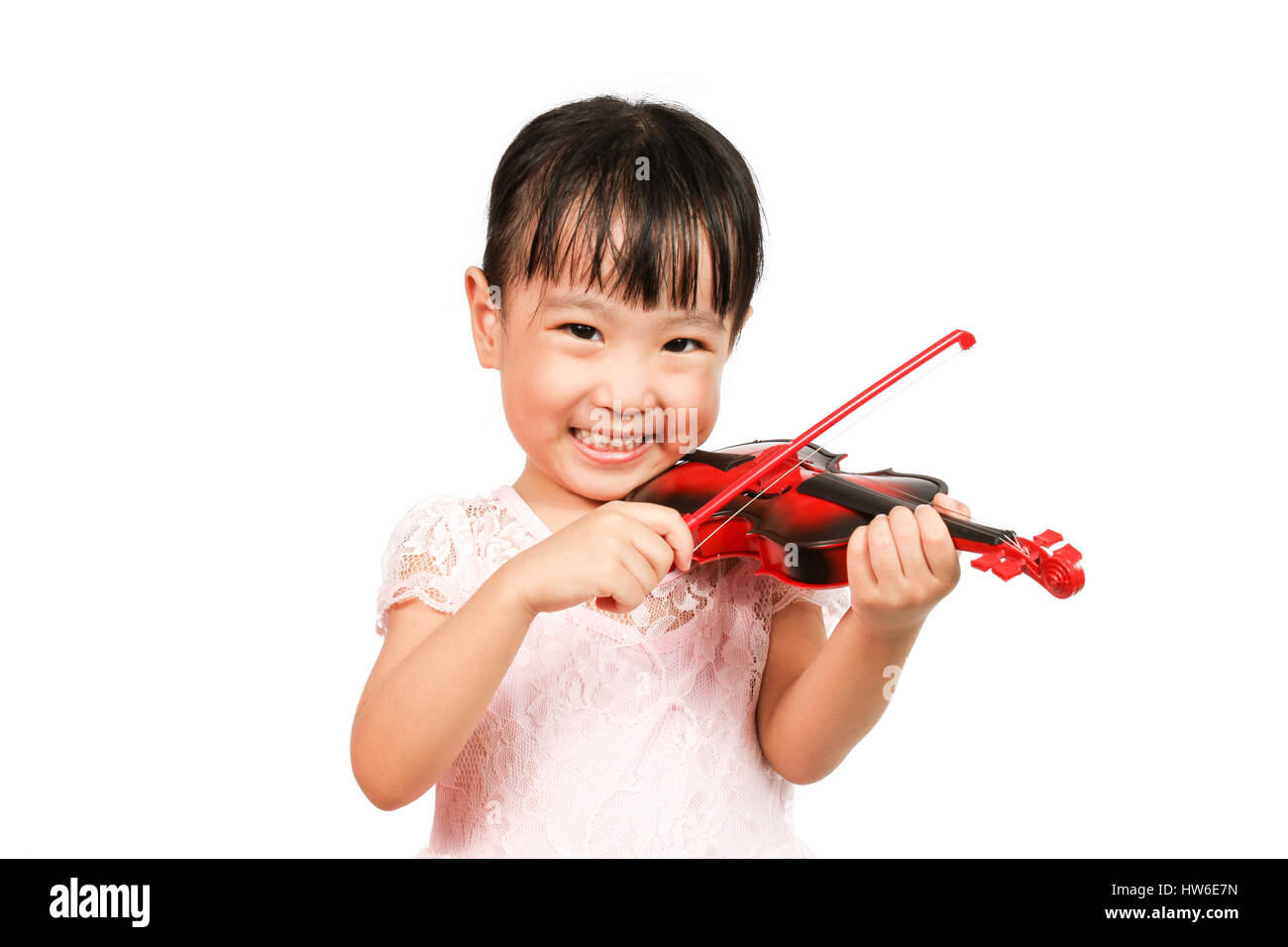 Chinese Little Girl Playing Violin on a white background Stock Photo