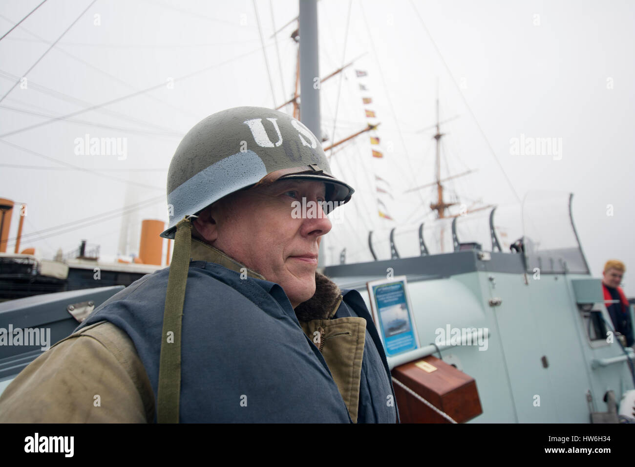 American soldier onboard the WW2 British MTB, Motor Torpedo Boat, looking away Stock Photo
