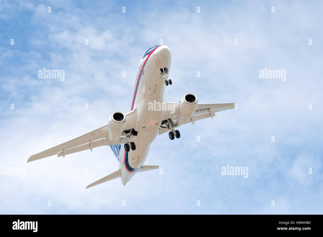 Russian developed Sukhoi Superjet 100-95 with undercarriage down on landing approach to Farnborough Airshow, UK Stock Photo