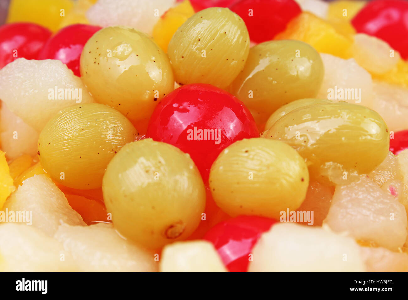 Fruit salad texture. Grape cherry pineapple mango pear. Stock Photo