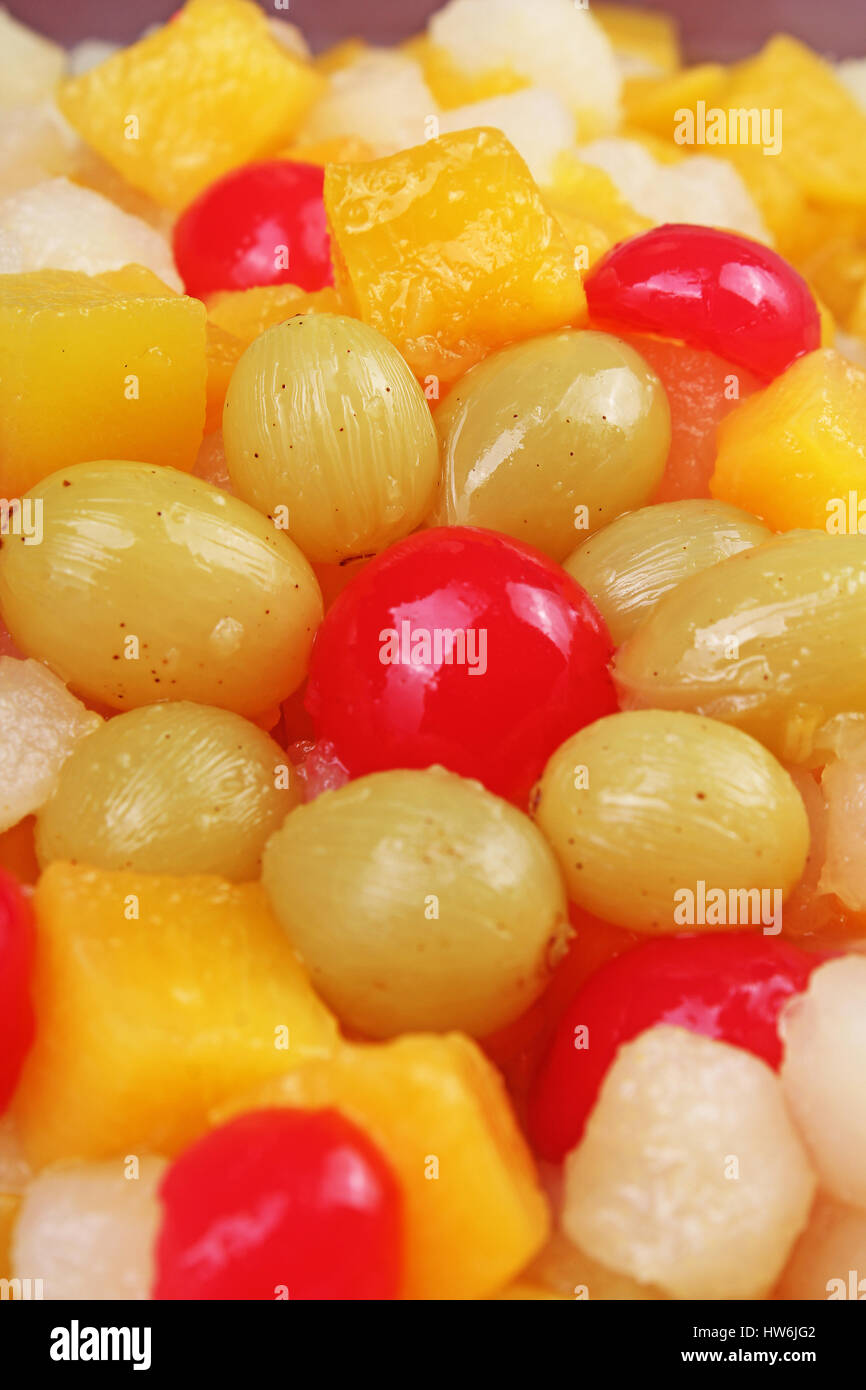 Fruit salad texture. Grape cherry pineapple mango pear. Stock Photo