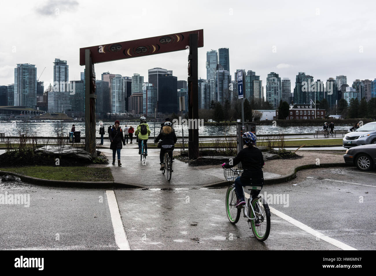 Vancouver city skyline from Stanley Park with bikers Stock Photo - Alamy