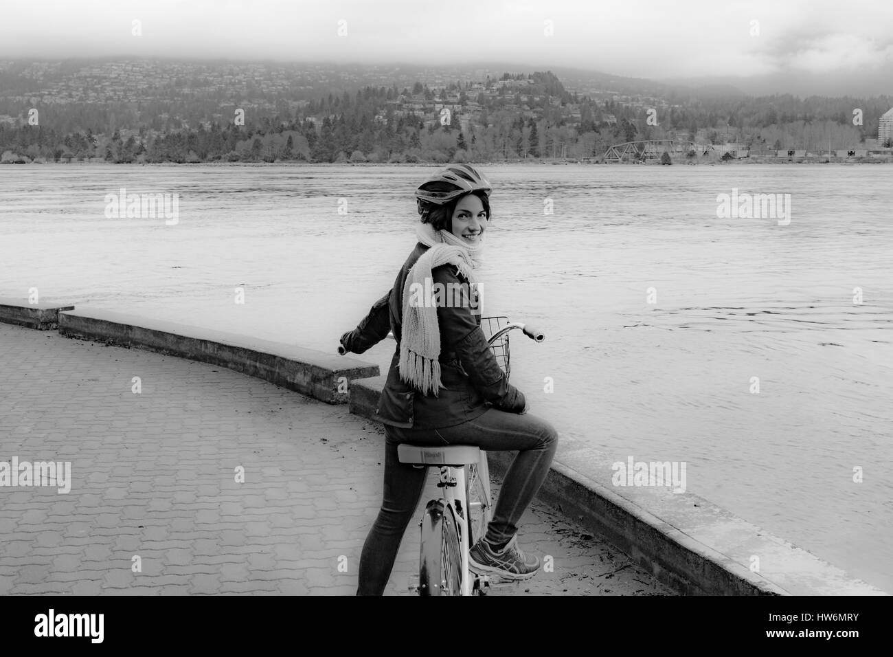 Girl on a bike in Stanley Park, Vancouver, Canada. Stock Photo