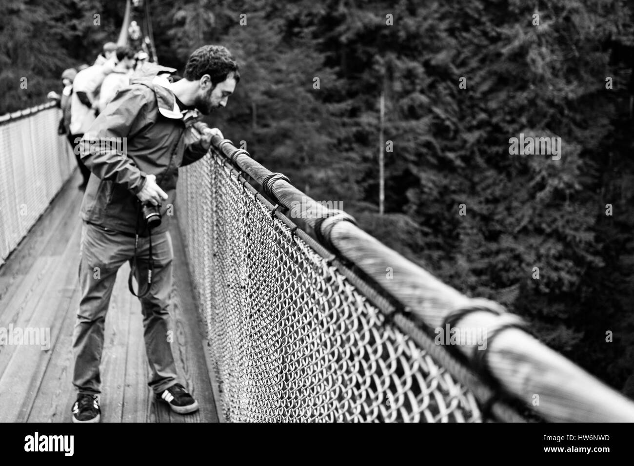 Looking over the edge of Capsilano suspension bridge in Vancouver, Canada. Stock Photo