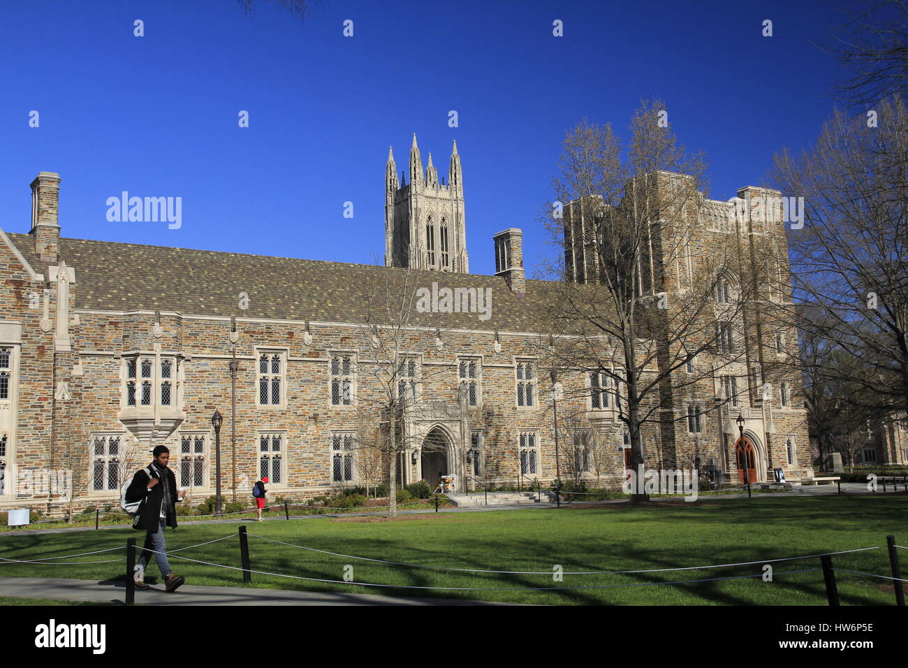 Students walking across campus lawn Duke University Durham North Carolina Stock Photo