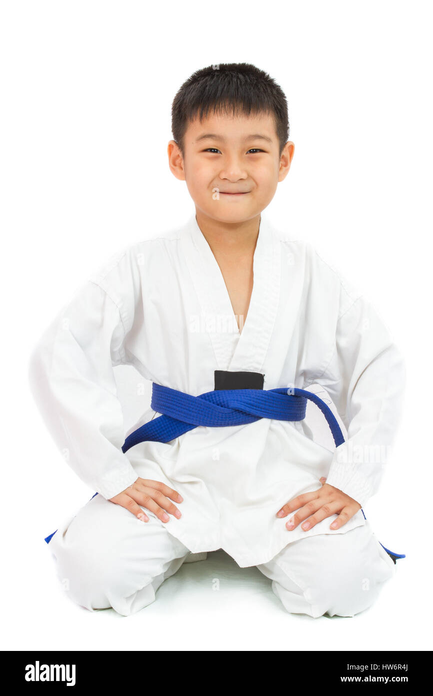 Asian Little Karate Boy in White Kimono on White Background Stock Photo