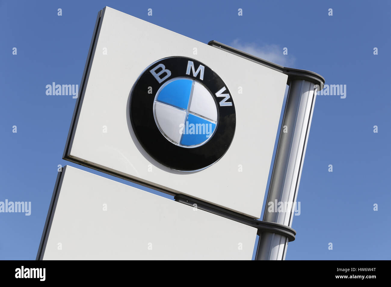 BMW dealership sign against blue sky Stock Photo