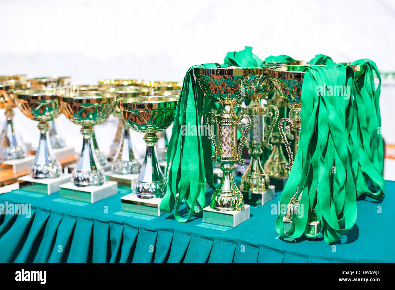 Victorious cups in sports meets Stock Photo - Alamy
