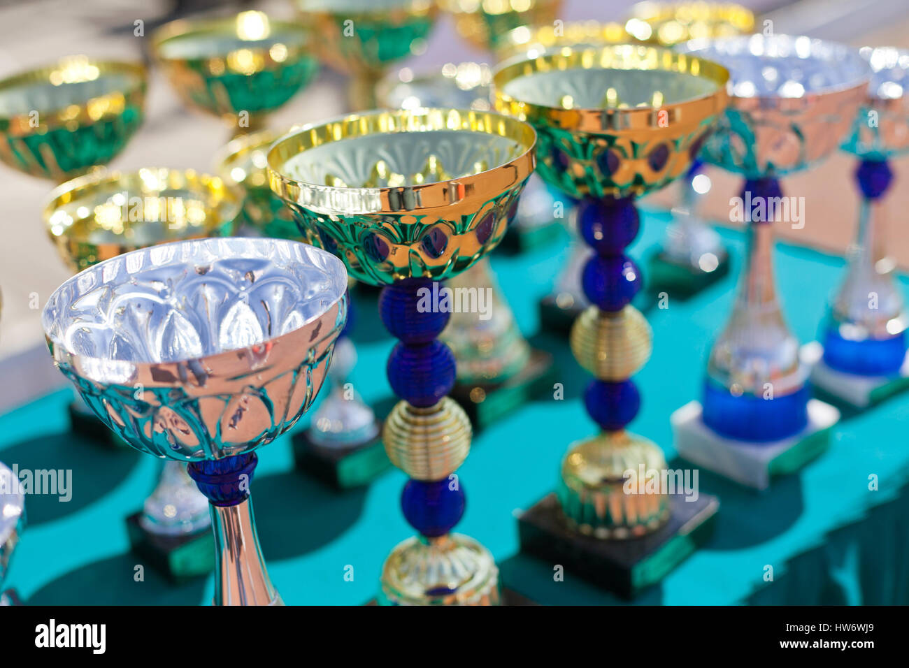 Victorious cups in sports meets Stock Photo - Alamy