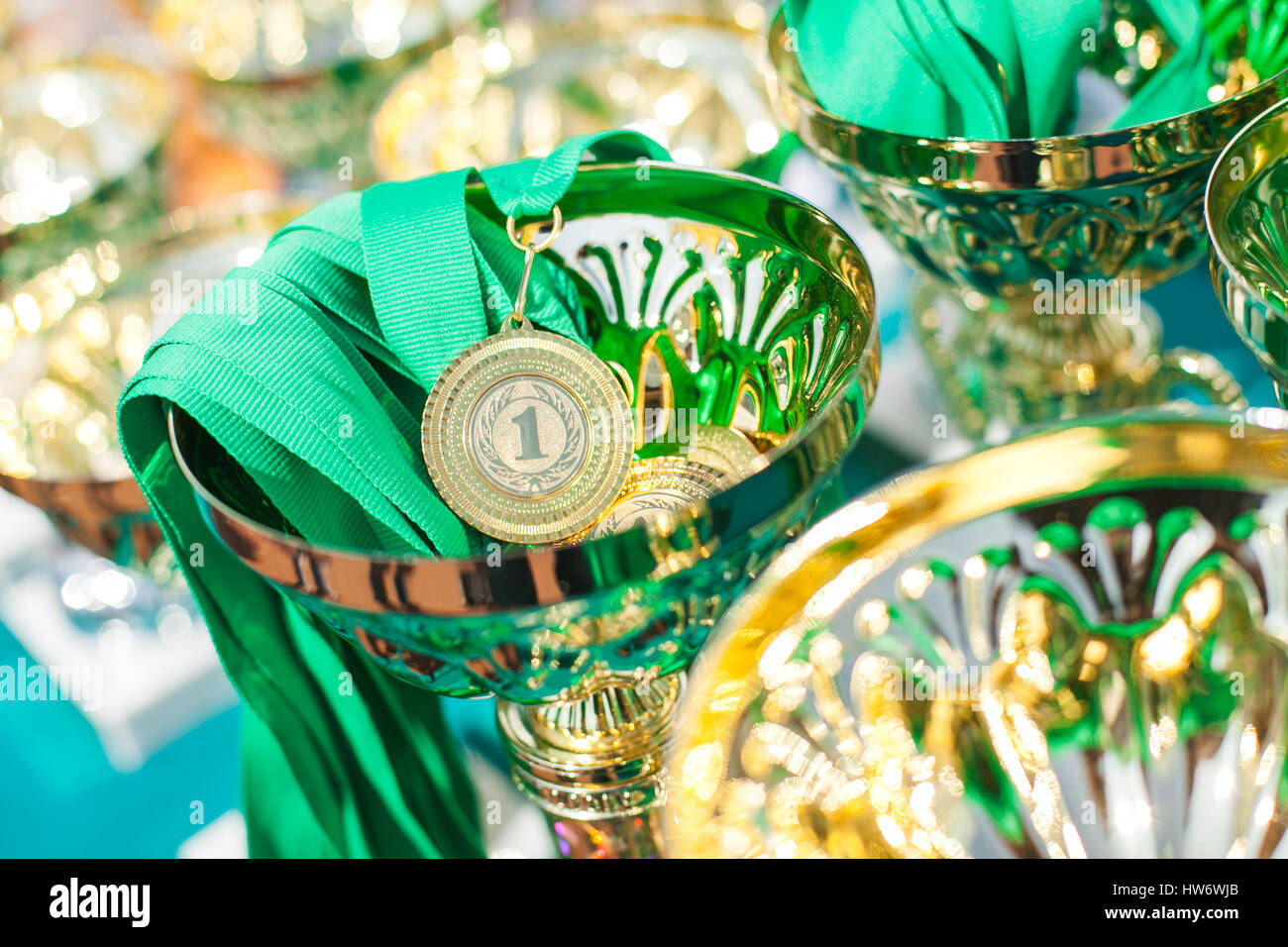 Victorious cups in sports meets Stock Photo - Alamy