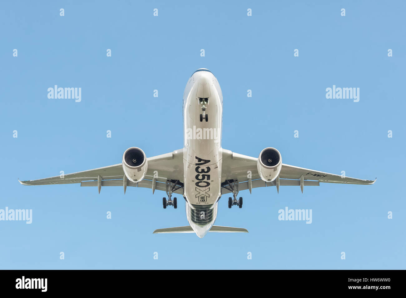 Airbus A350 XWB, in a clear blue sky, landing at an international aviation trade event in Farnborough, UK Stock Photo