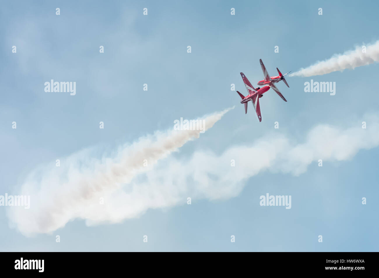 Close pass by The Red Arrows formation aerobatic display team at an airshow over Farnborough, UK Stock Photo