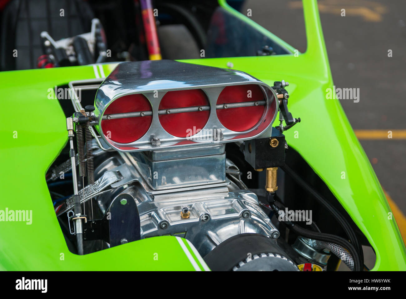 The air intake of a v8 in a green hot rod Stock Photo Alamy