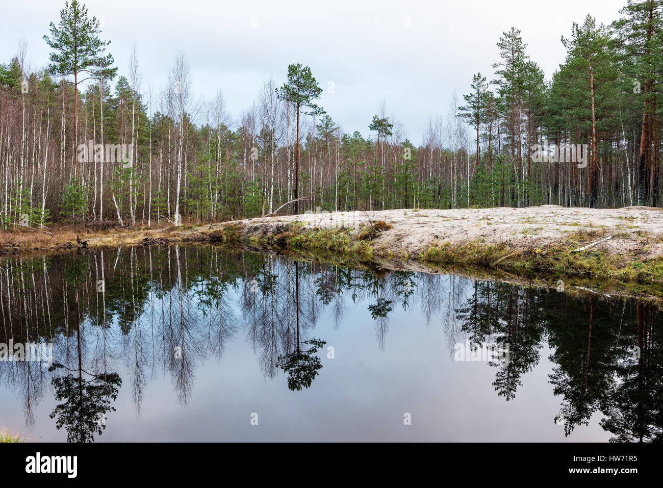 Calm lake with reflections in late autumn Stock Photo - Alamy