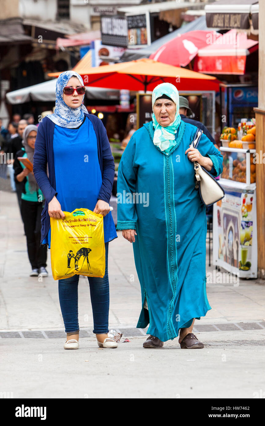 Fes, Morocco.  Juxtaposition of Modern and Traditional Dress Styles, Fes El-Bali. Stock Photo