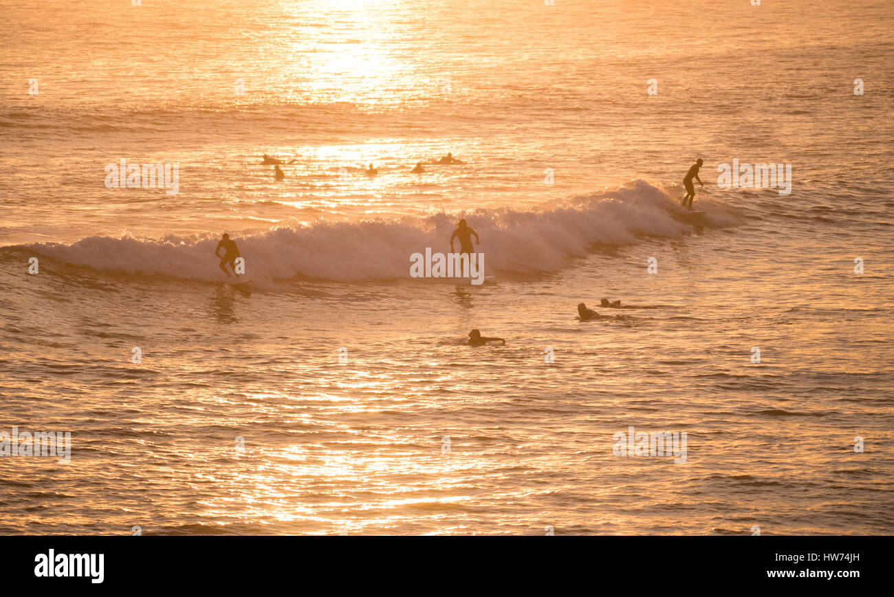 Surfers catching a wave in Huntington Beach, California.  Surf City USA. Stock Photo