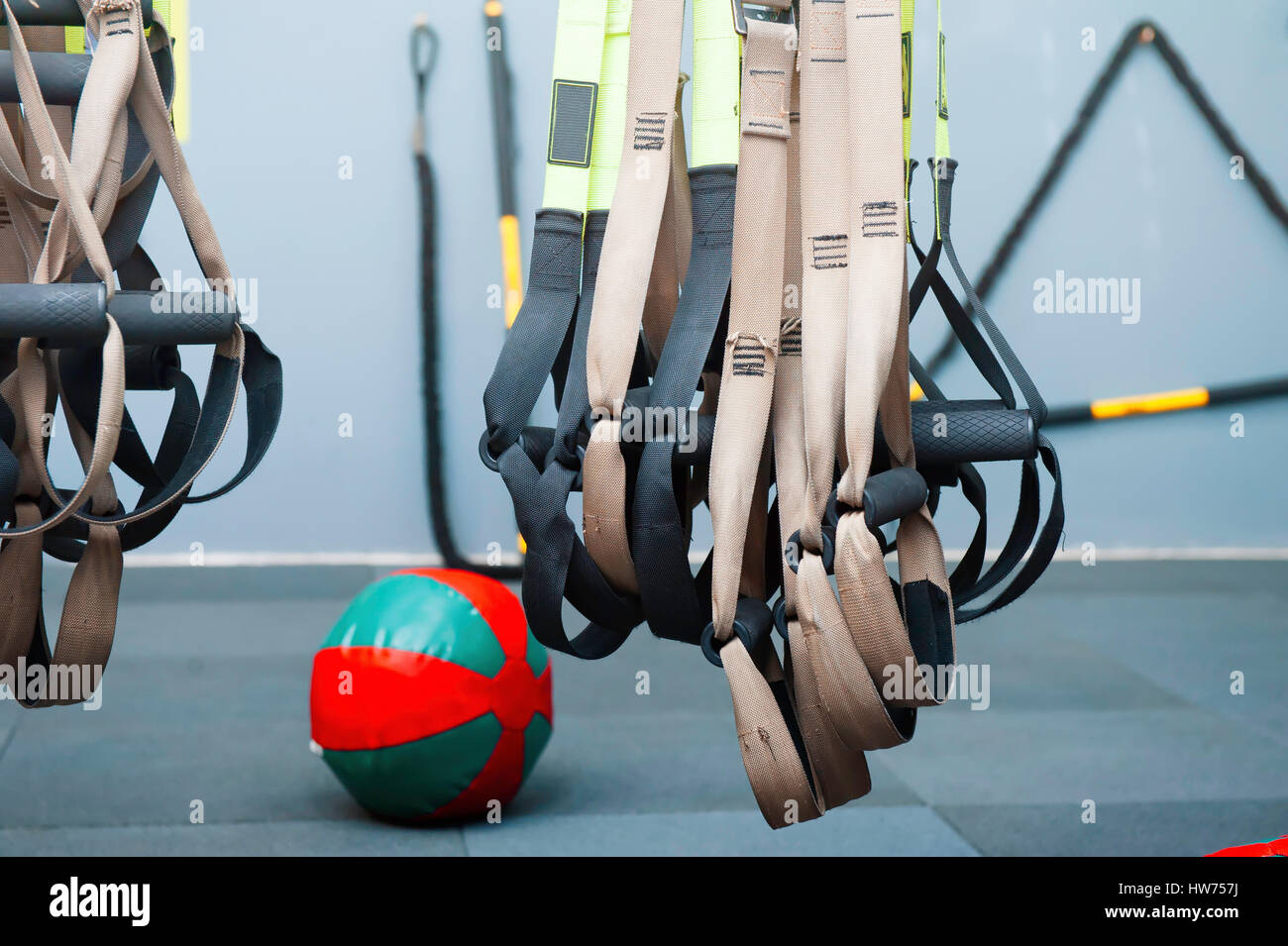 Different sizes of kettlebells weights lying on gym floor. Equipment