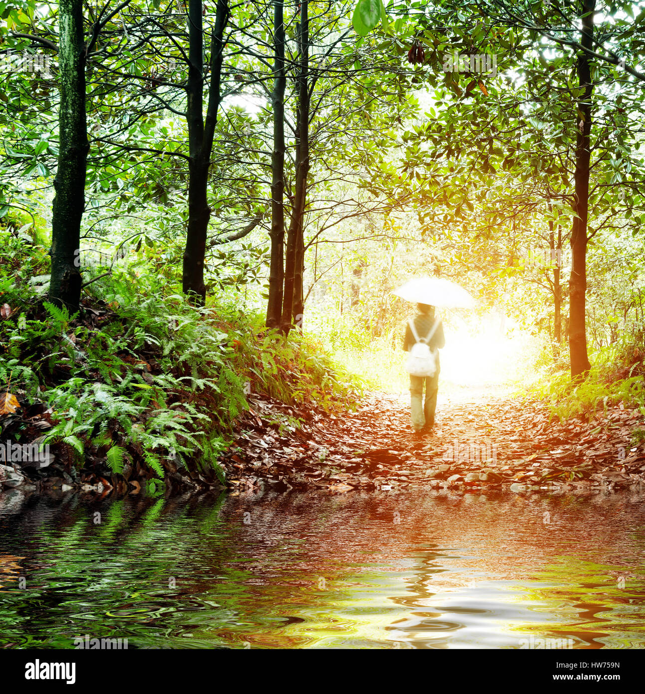 Solitude concept - lonely sad woman in the woods Stock Photo