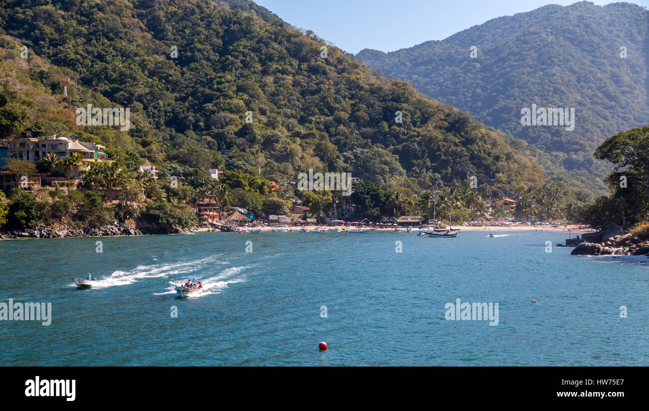 Water taxi's leave Boca de Tomatlan , south of Puerta Vallarta Mexico , to transport locals and tourists to the many beaches along the coast. Stock Photo
