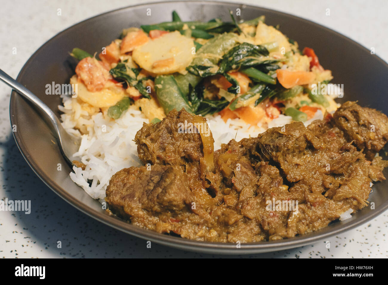 Bowl of Beef rendang Stock Photo - Alamy