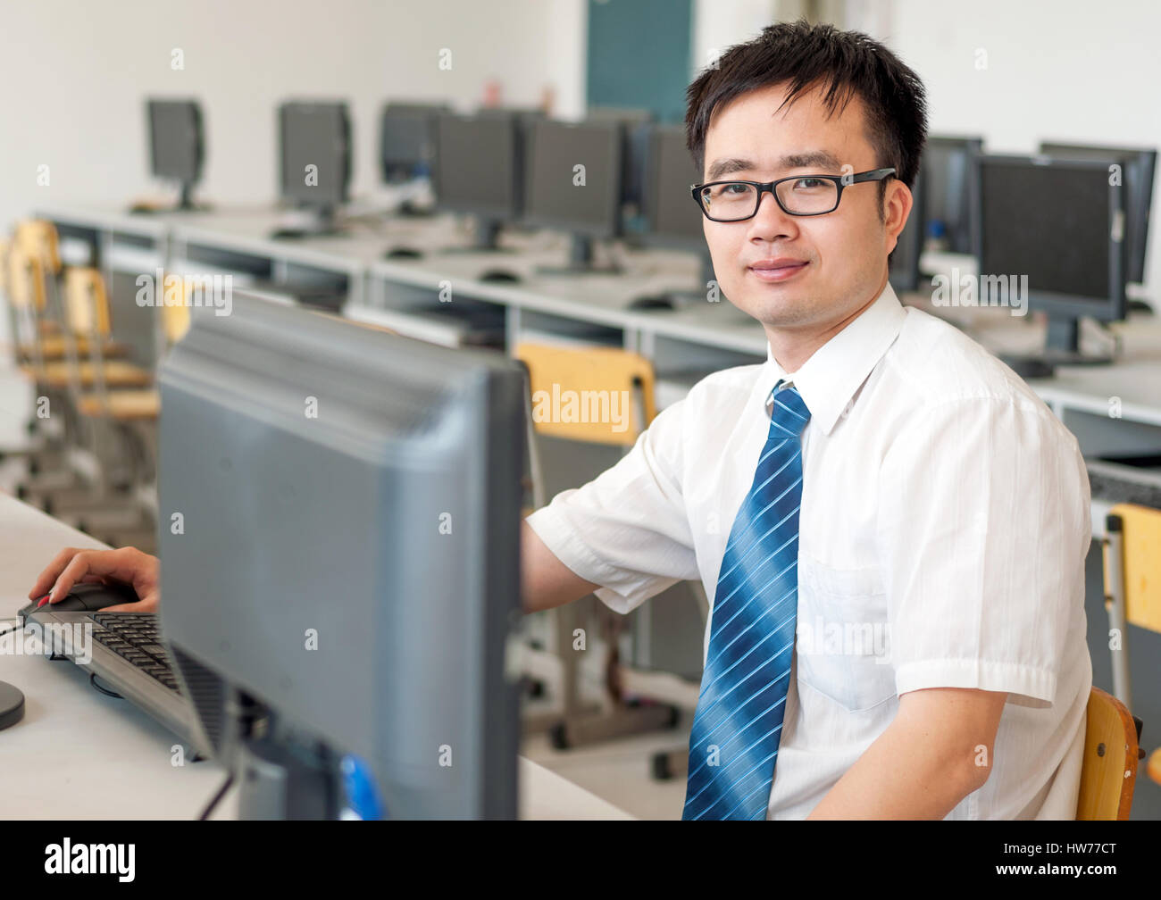 Asian man in front of the computer work Stock Photo - Alamy