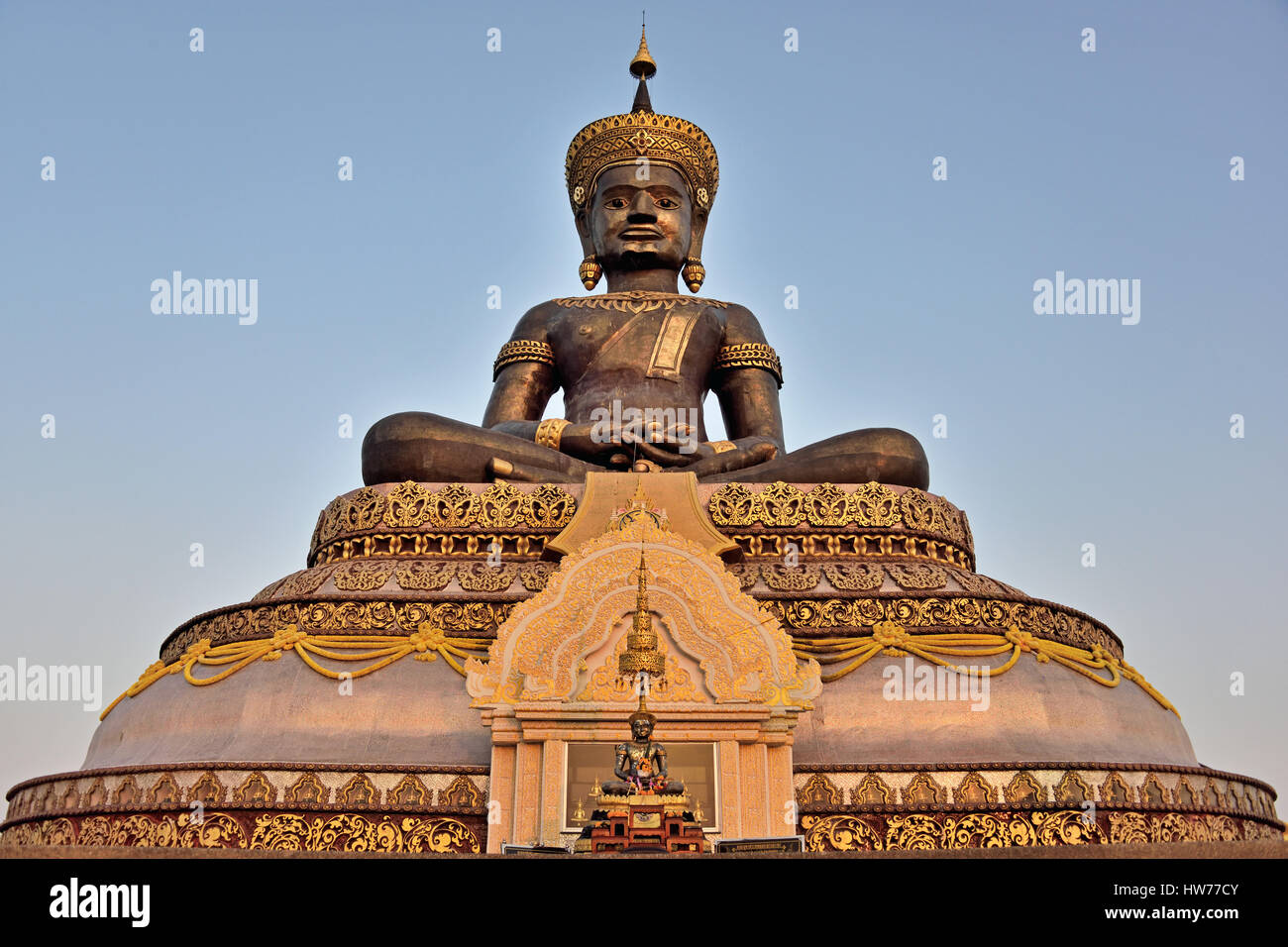 The Phramaha Thammaracha Chalermprakiat statue at Wat Traiphum in the early evening sunlight in Petchabun in Thailand Stock Photo