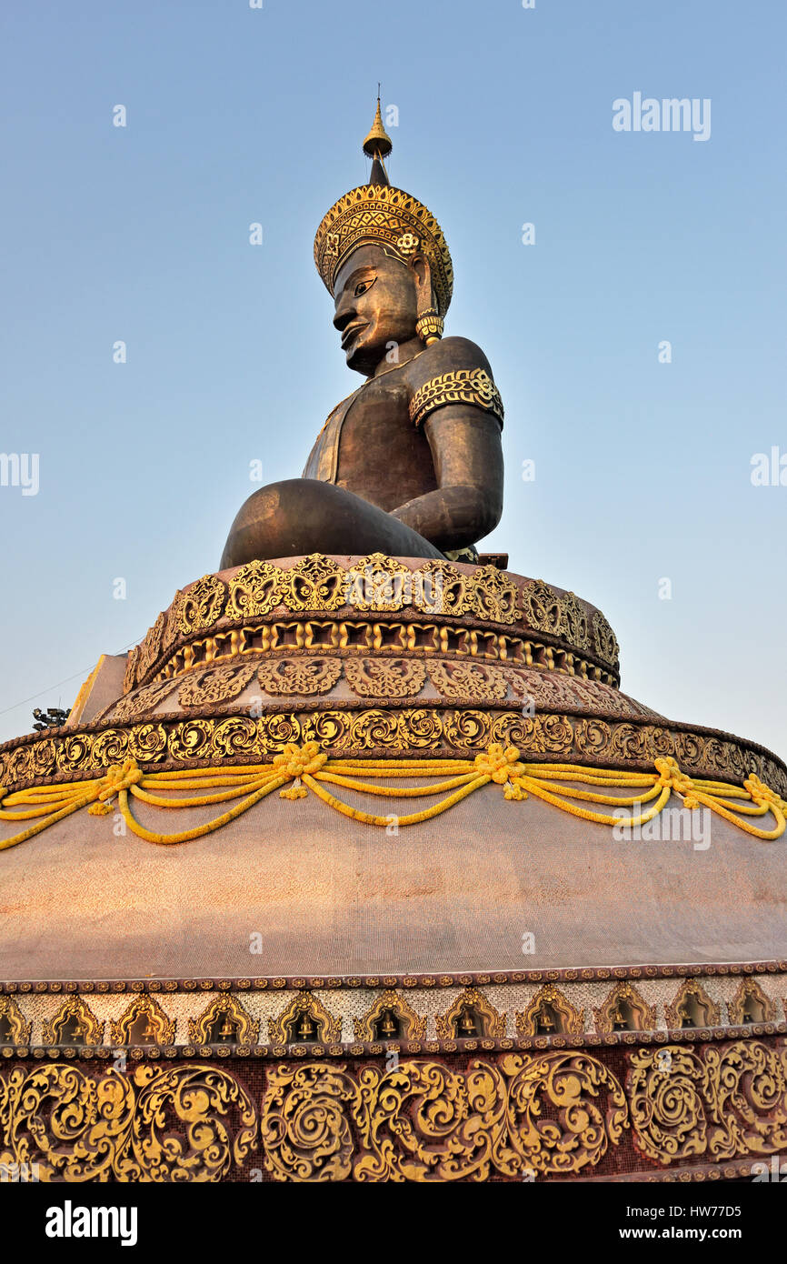 The Phramaha Thammaracha Chalermprakiat statue at Wat Traiphum in the early evening sunlight in Petchabun in Thailand Stock Photo