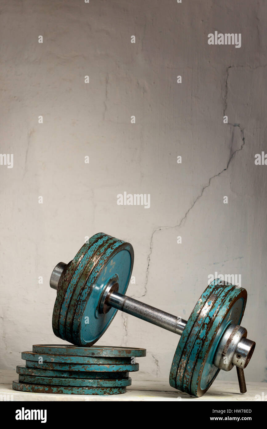 Heavy vintage dumbbells for training. Stock Photo