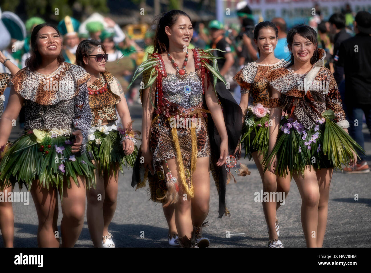 St. Patrick's Day Thailand and Thai females dressed in green grass skirts for the street parade. Woman grass skirt Stock Photo