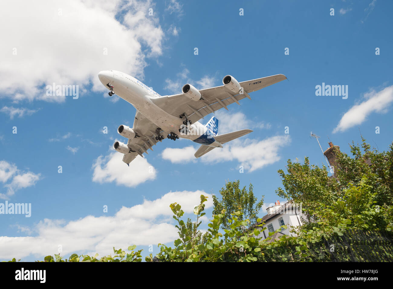 The first A380 produced by Airbus nearly a decade ago on landing approach to the Farnborough Airshow, UK on July 14, 2014 Stock Photo