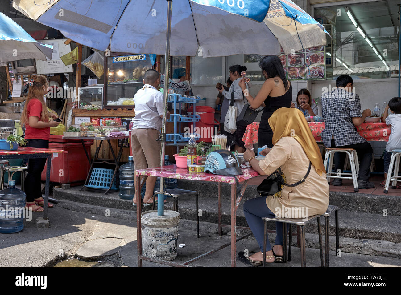 Thailand people eating outside at a street food stall. Thailand Southeast Asia Stock Photo